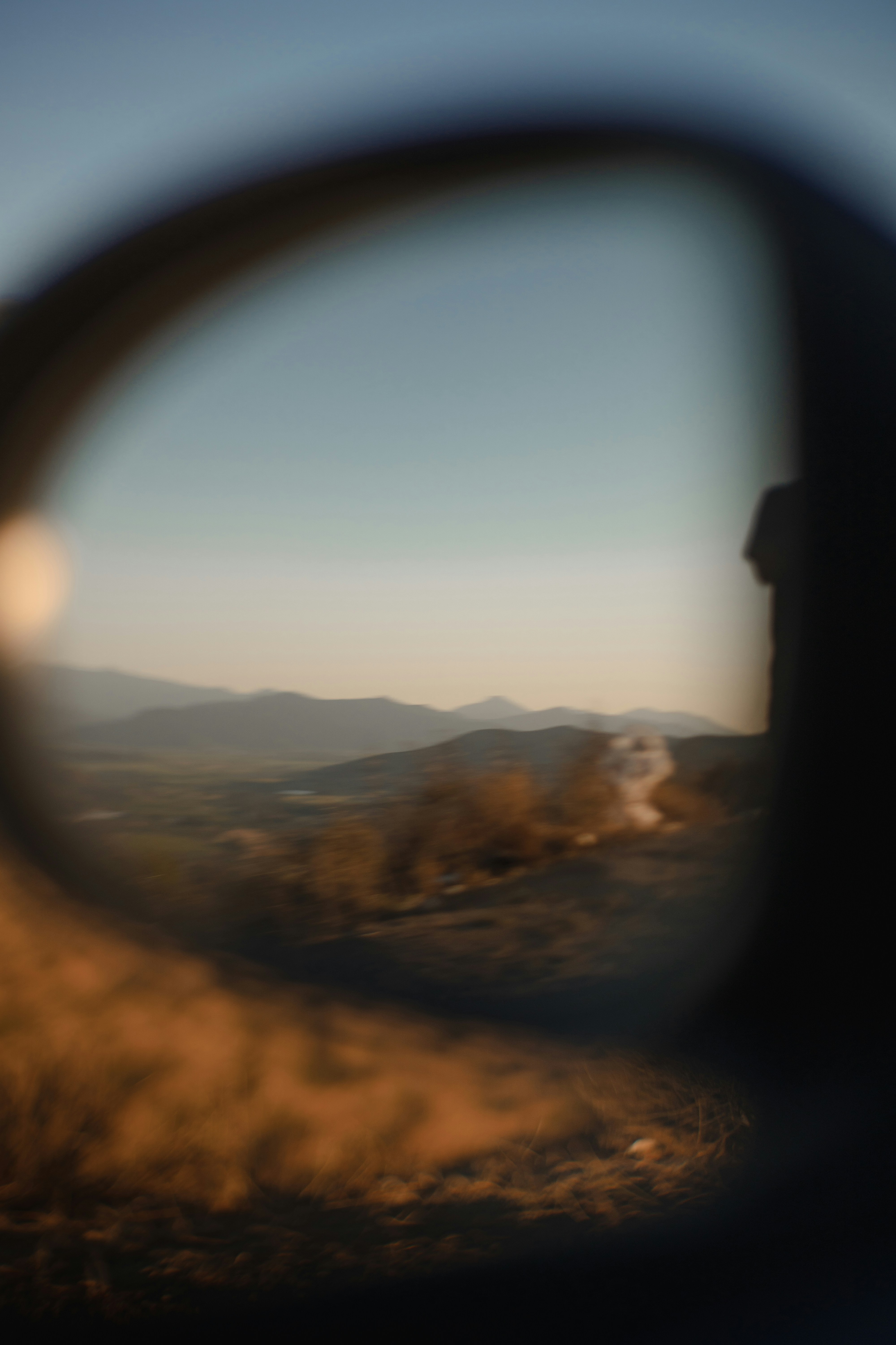 brown and black mountains under white clouds during daytime