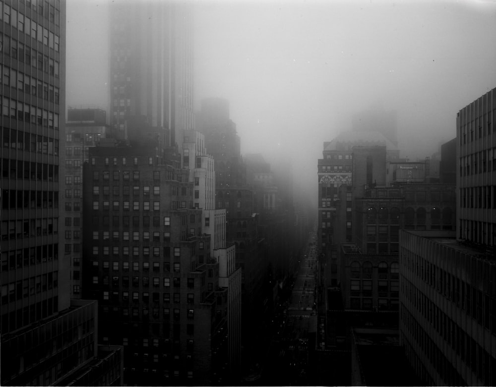 grayscale photo of city buildings