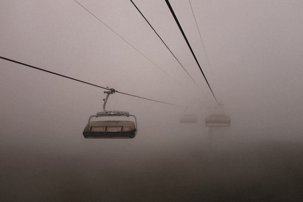 white cable car on foggy weather