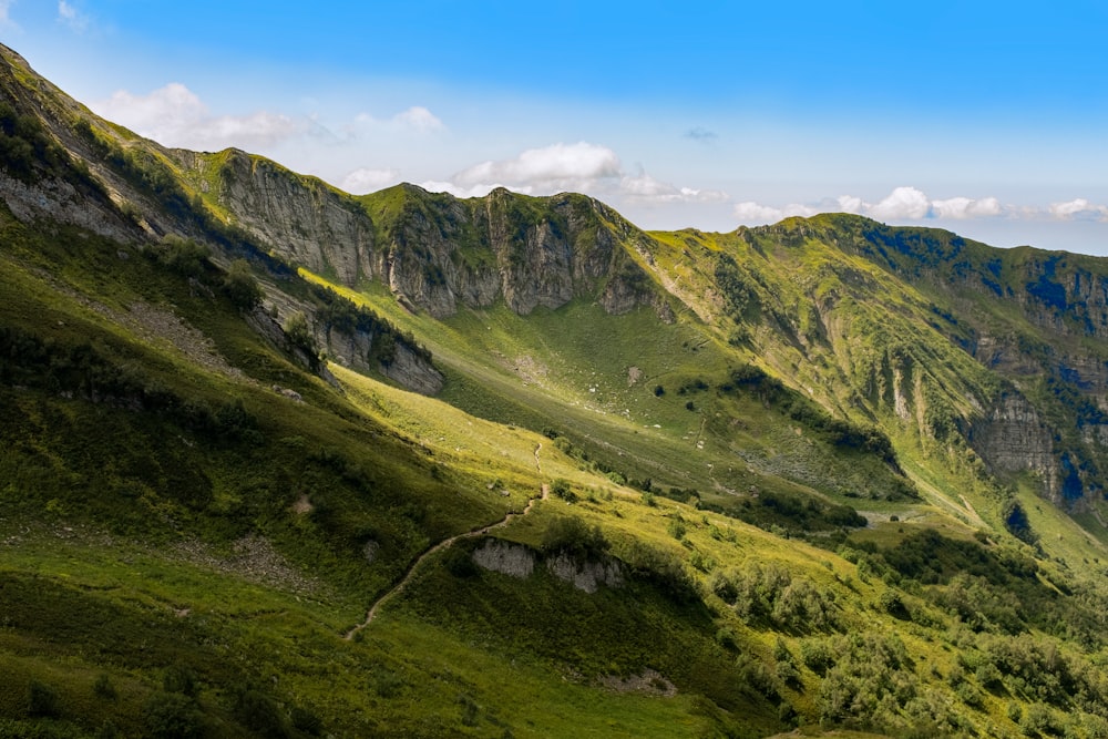 green and brown mountains under blue sky during daytime