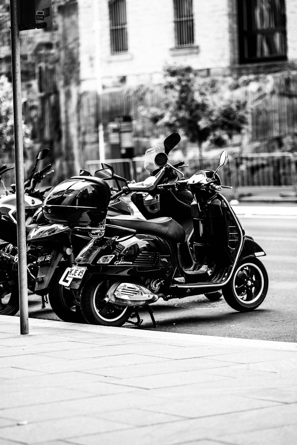 grayscale photo of parked motorcycle