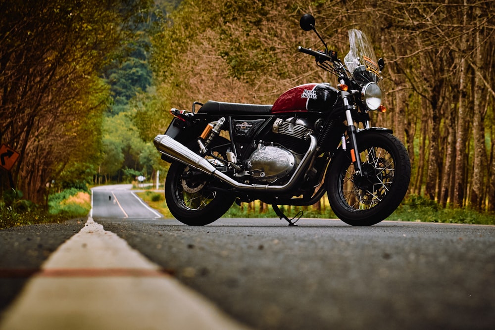 red and black motorcycle on road during daytime