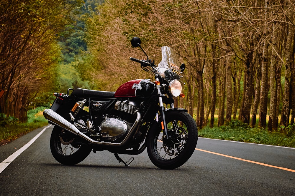 red and black motorcycle on road during daytime