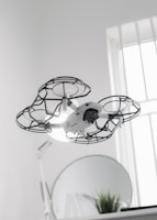 Indoor drone perspective flying through a stylish hallway with contemporary art and warm tones.