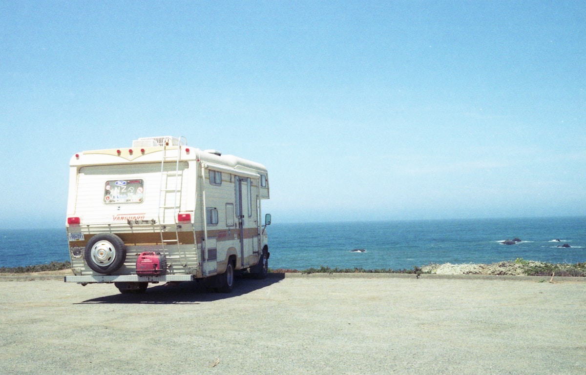 A RV looks out onto the open water