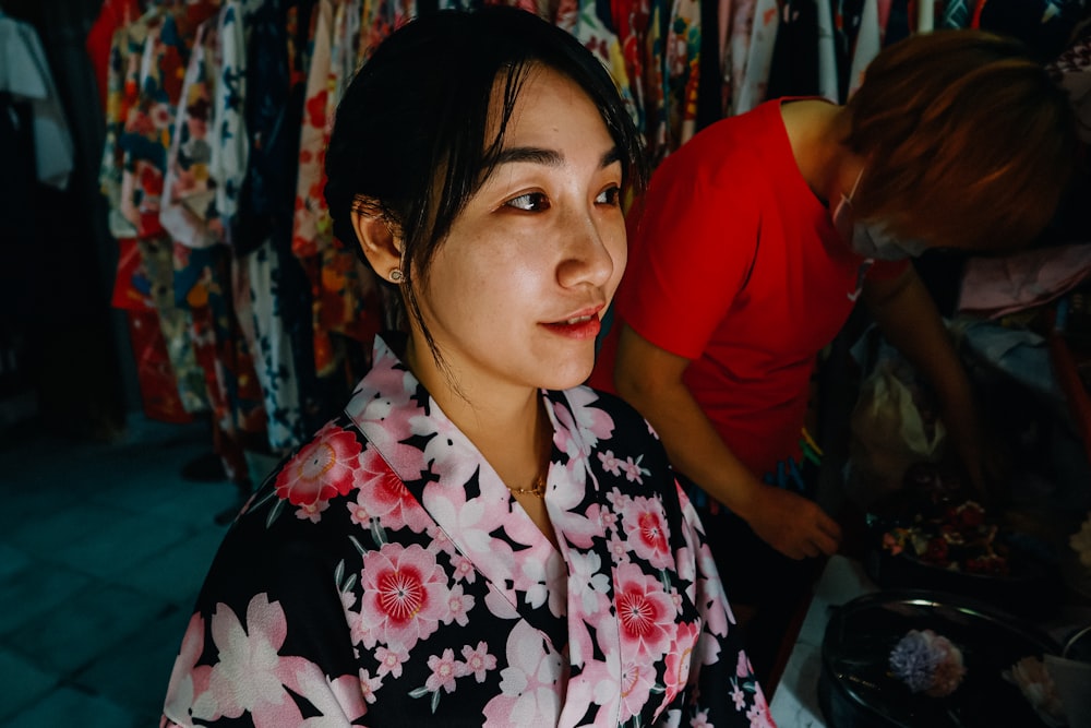 woman in white and pink floral button up shirt