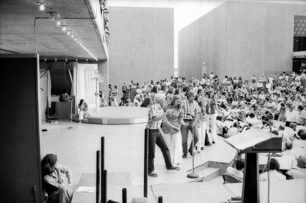 people sitting on chairs inside building