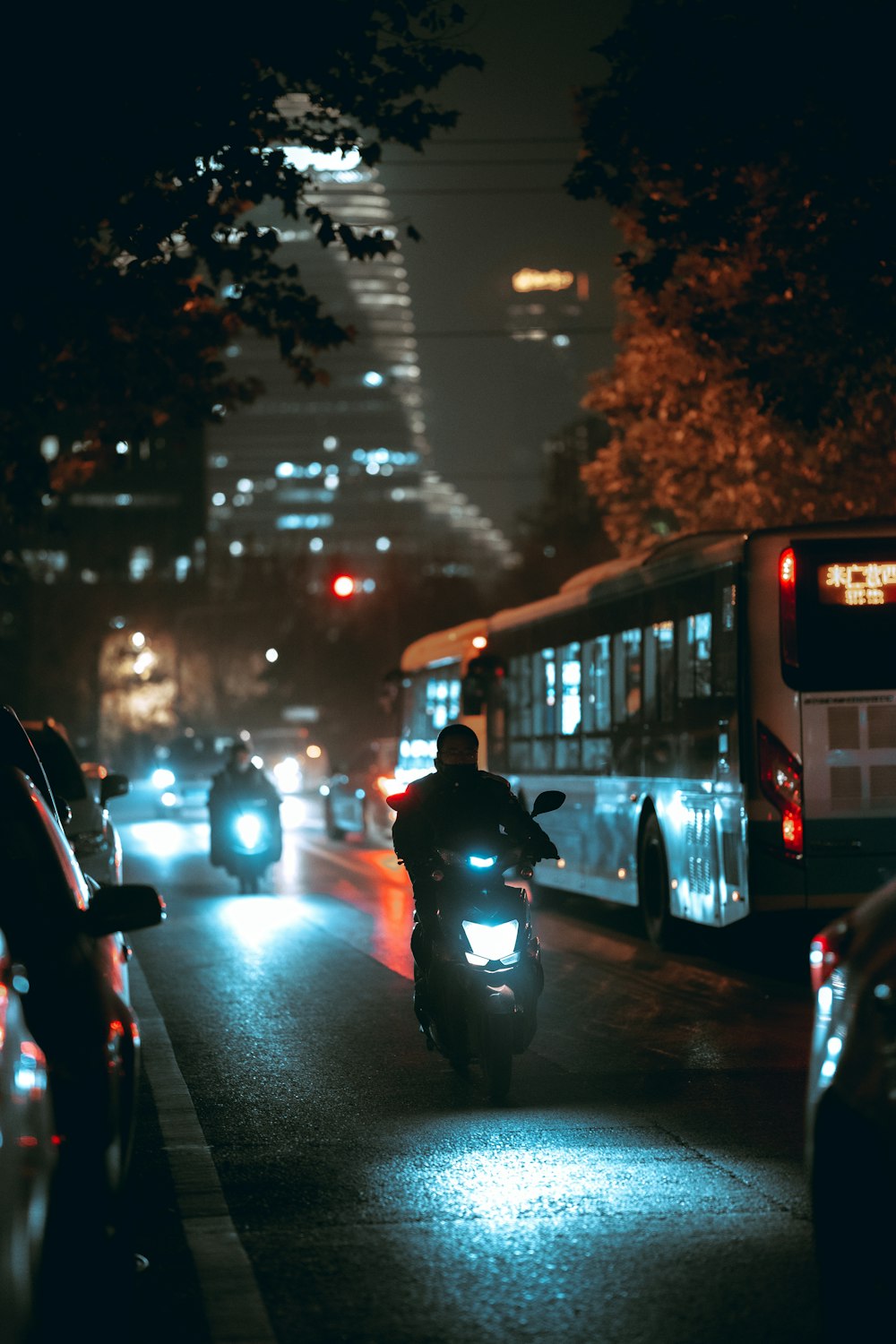 people walking on sidewalk during night time