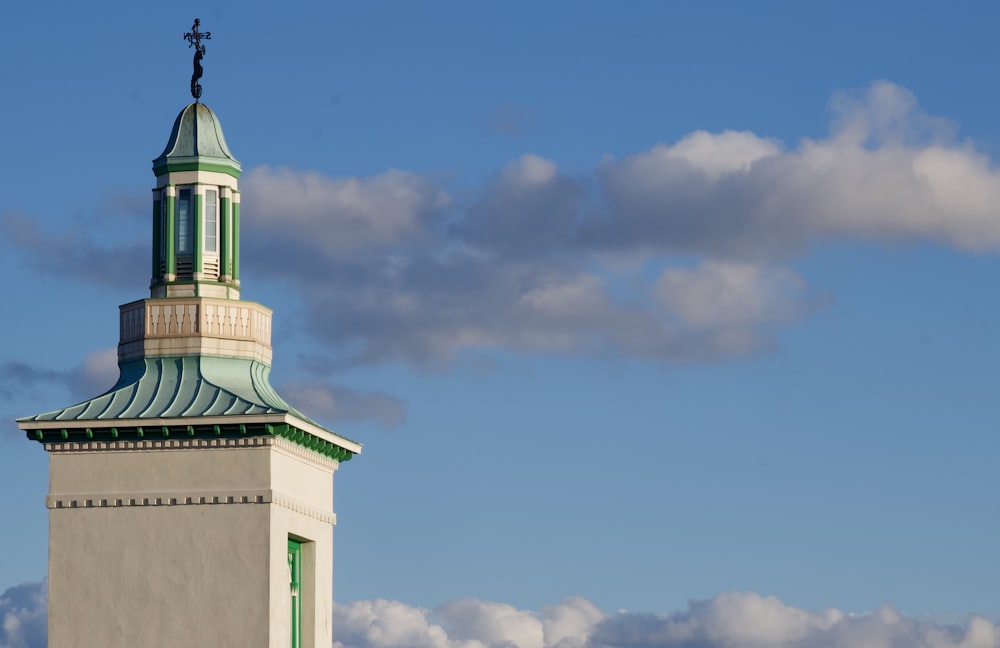 white and green concrete building under blue sky during daytime