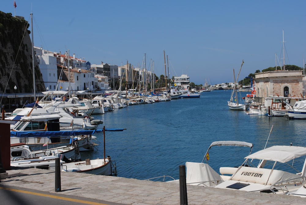 white and blue boat on sea during daytime