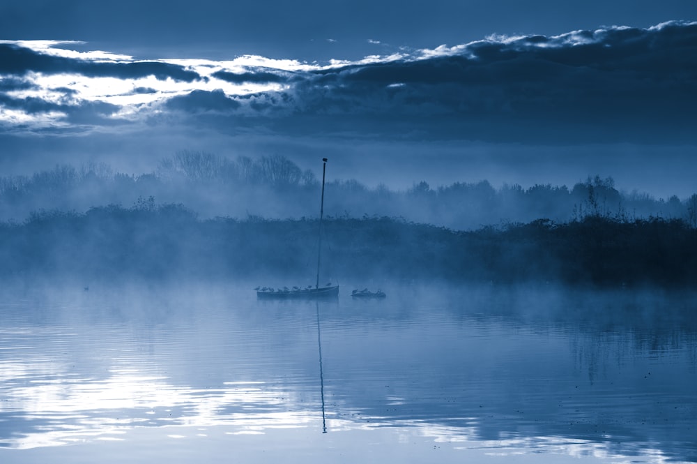 body of water under blue sky