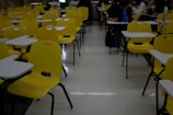 people sitting on yellow chairs