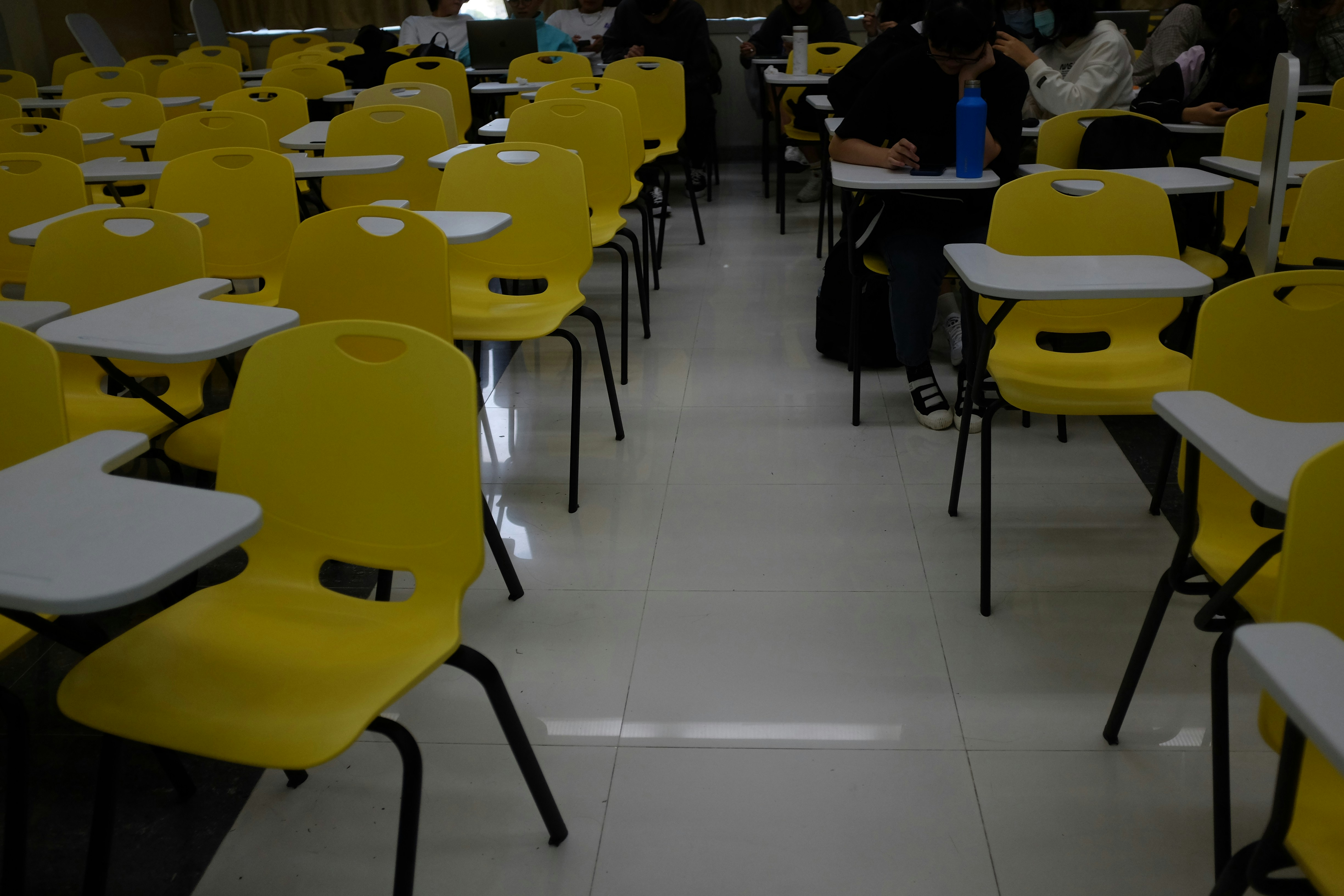people sitting on yellow chairs