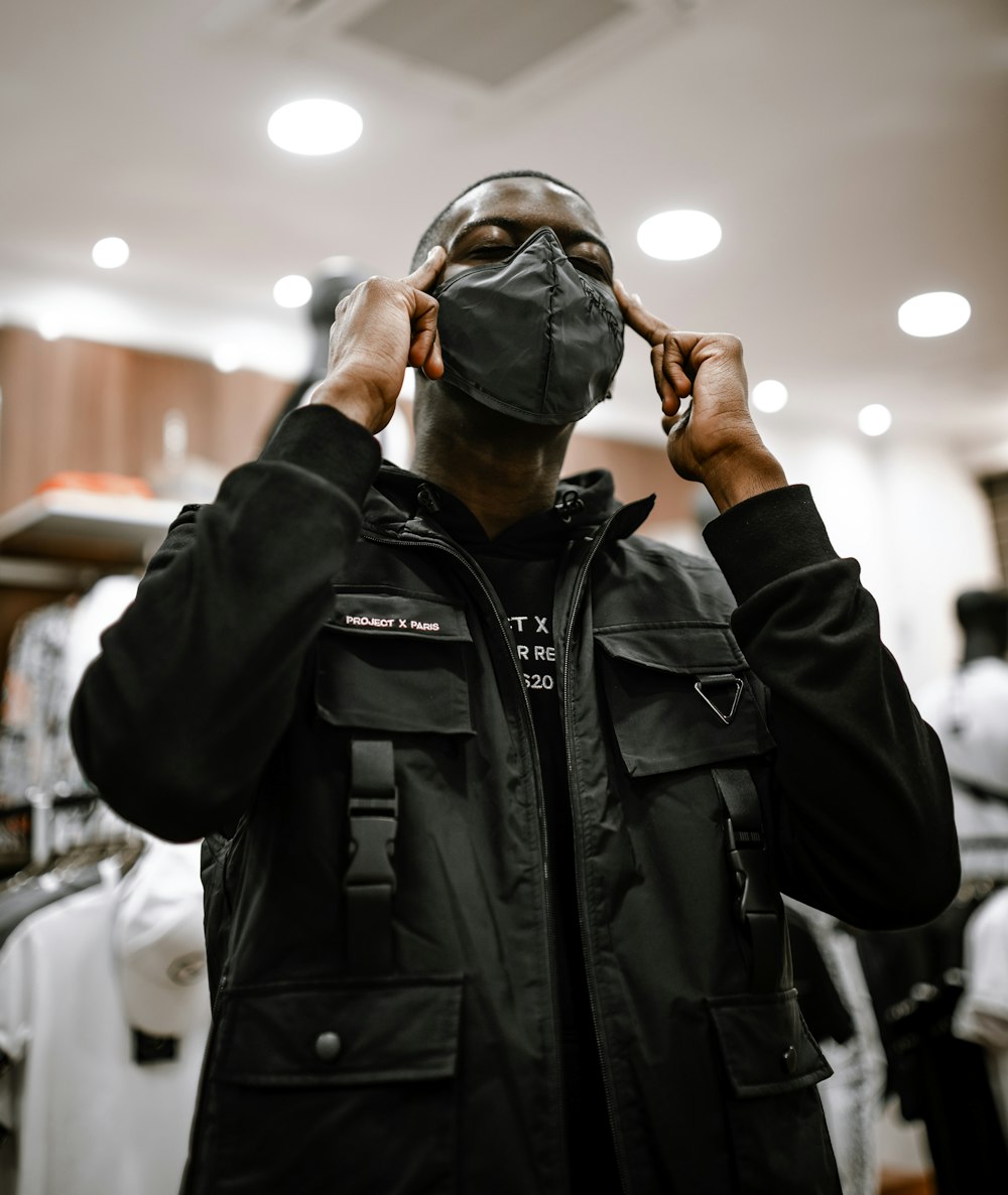 man in black leather jacket wearing black framed eyeglasses