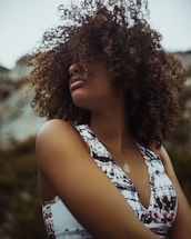 woman in white and blue floral tank top