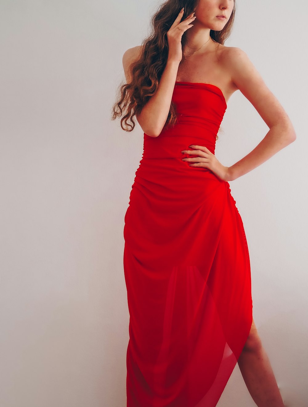 woman in red tube dress
