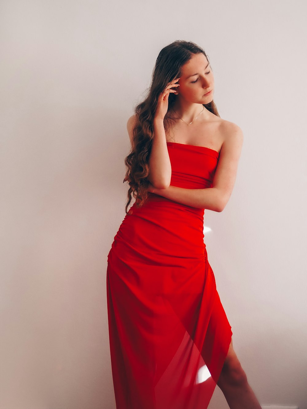 woman in red tube dress