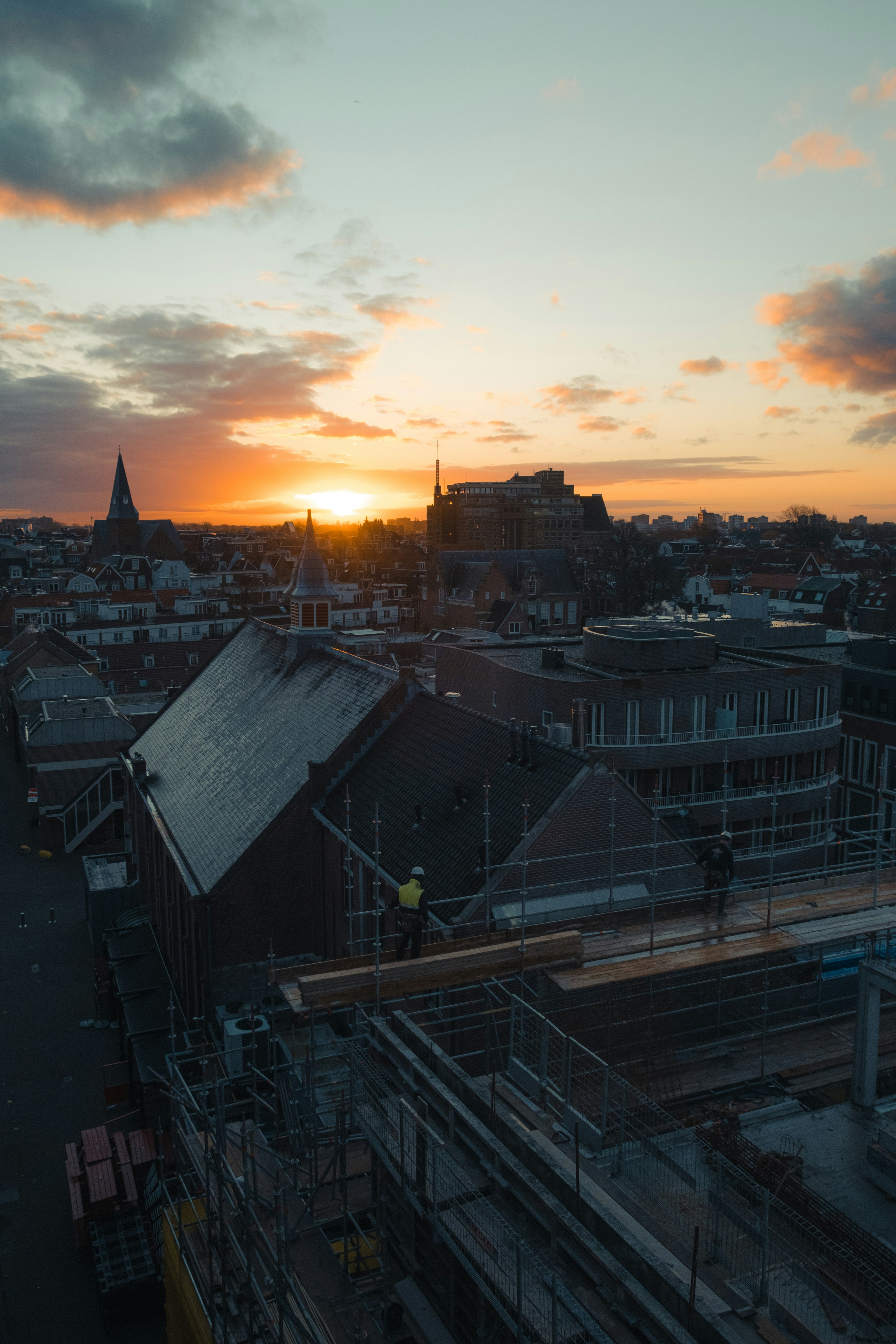 city buildings under cloudy sky during sunset