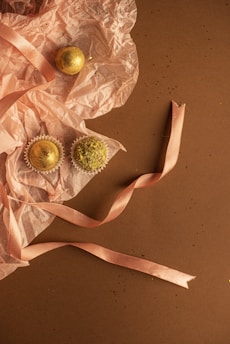 Elegant box of signature almond rochers with a shimmering gold ribbon.