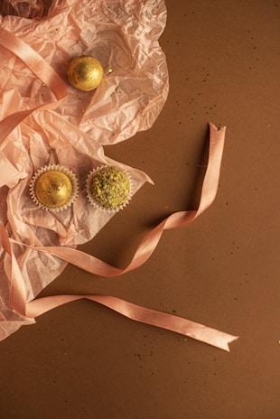 A small batch of premium dog treats packaged elegantly with beige and gold accents.