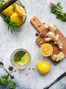 sliced lemon beside sliced lemon on chopping board