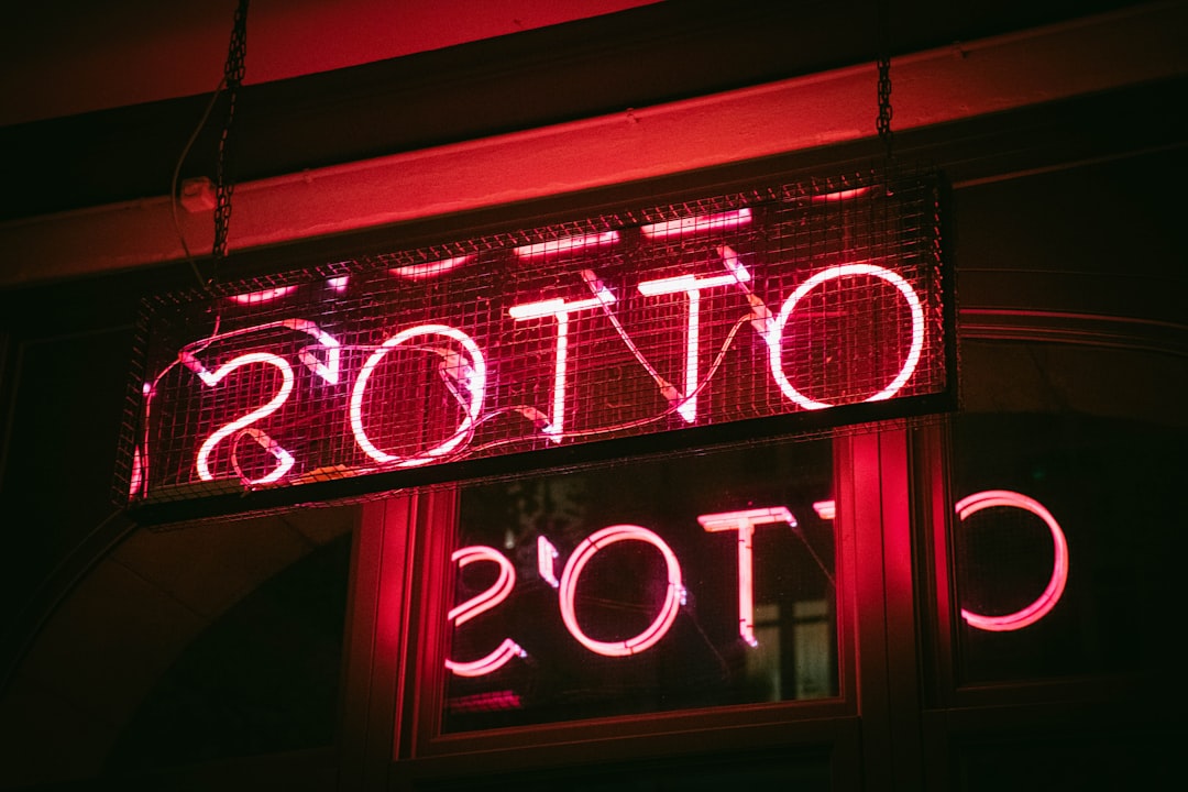 red and white UNKs neon light signage