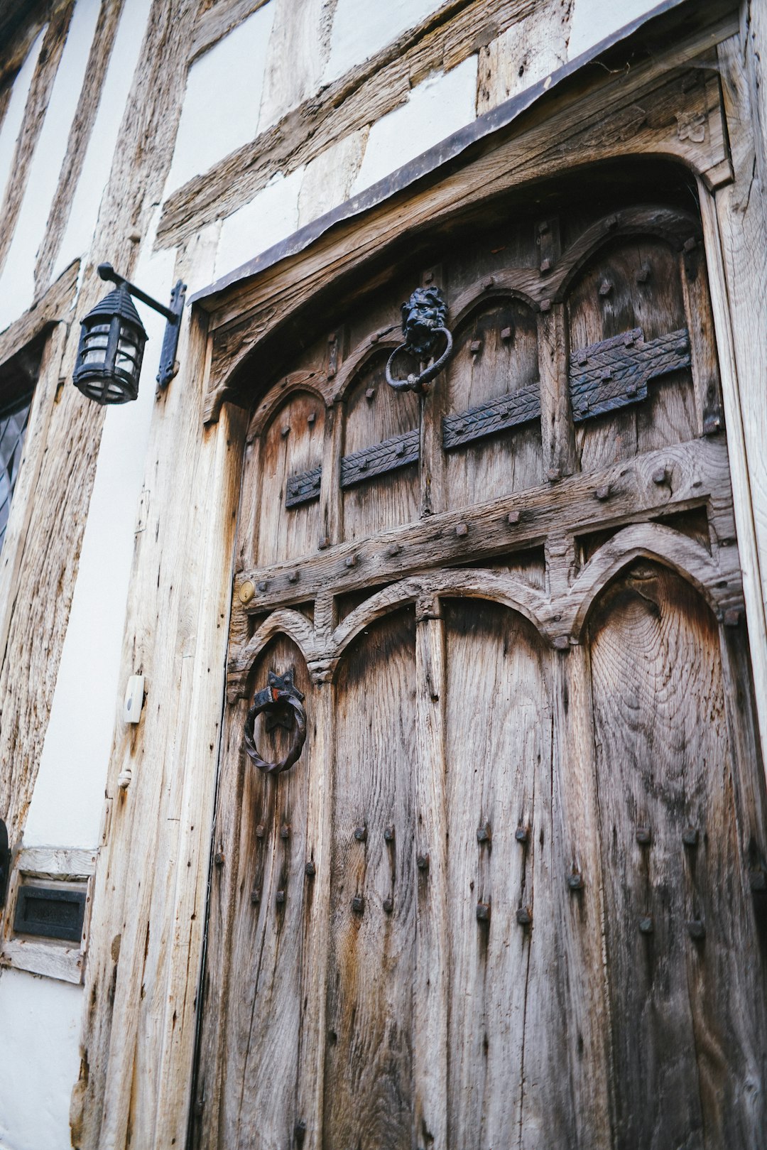 brown wooden door with black steel door knob