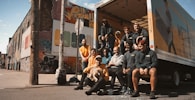 group of people sitting on black bench