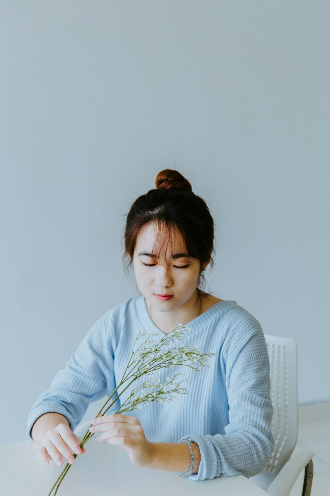 woman in white and green striped long sleeve shirt