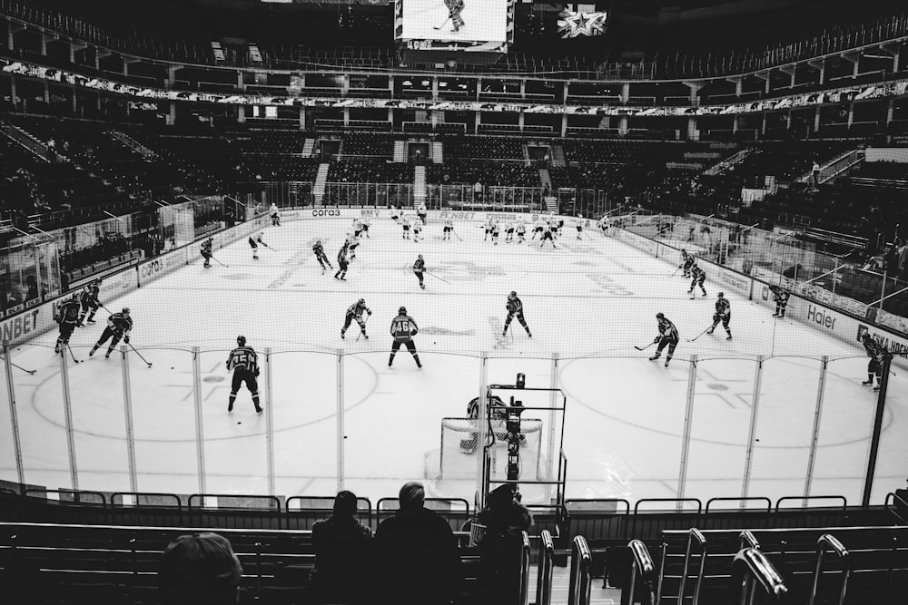 people playing ice hockey on ice field