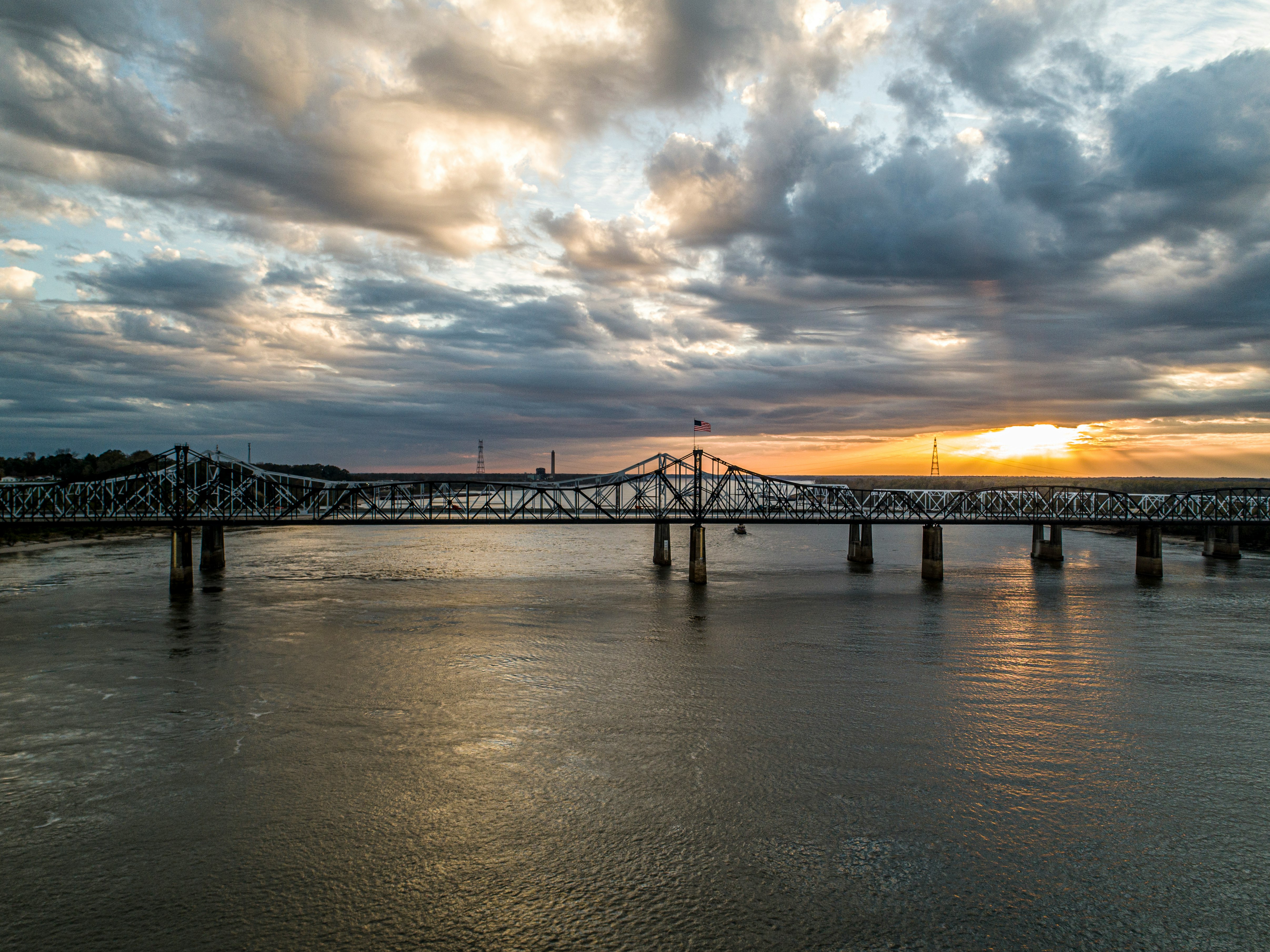 bridge over water during sunset