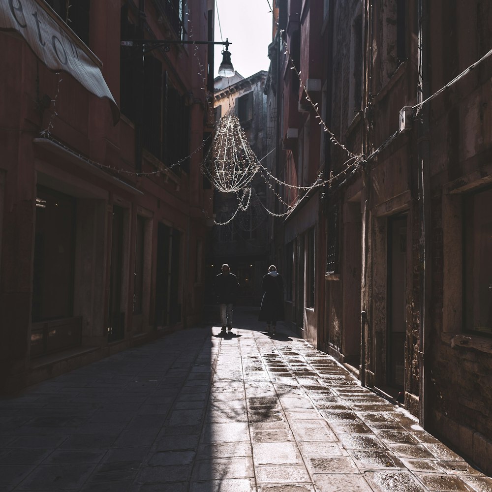 person walking on sidewalk during daytime