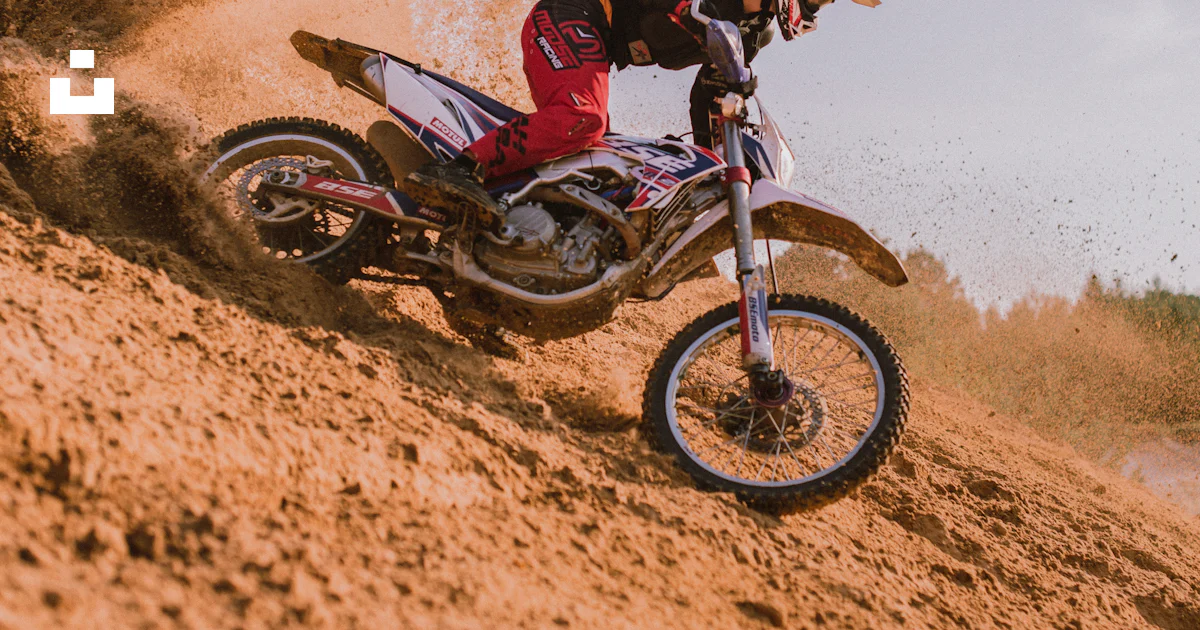 Motocross Riding A Rut Man in red and black motocross suit riding motocross dirt bike photo ...