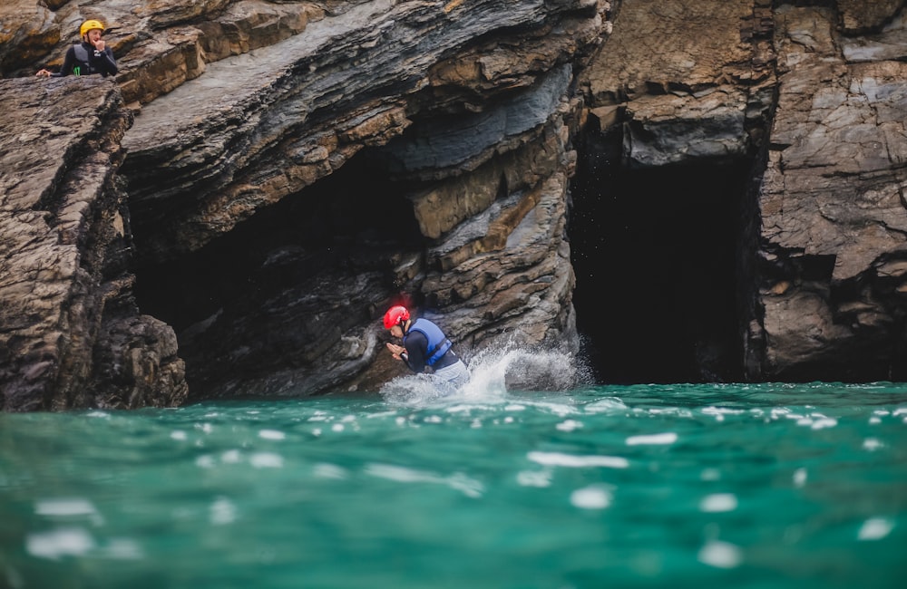 person in blue swimming suit on water