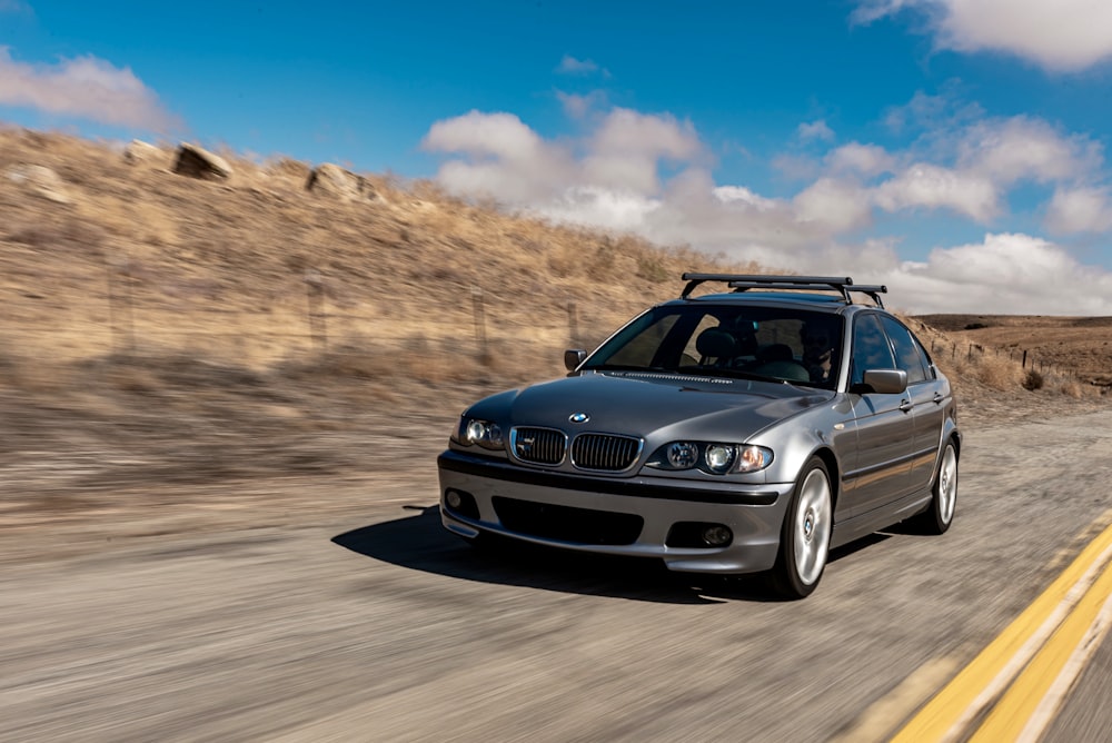 blue bmw m 3 on road during daytime