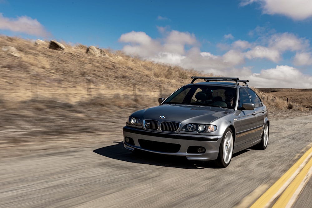 blue bmw m 3 on road during daytime