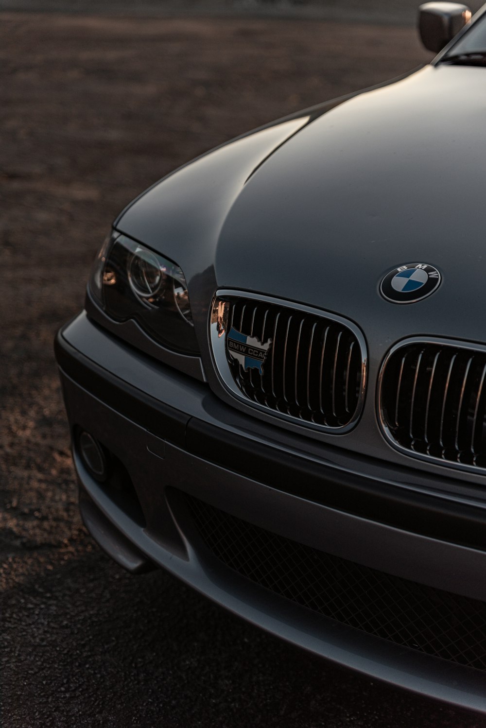 black bmw car on brown soil