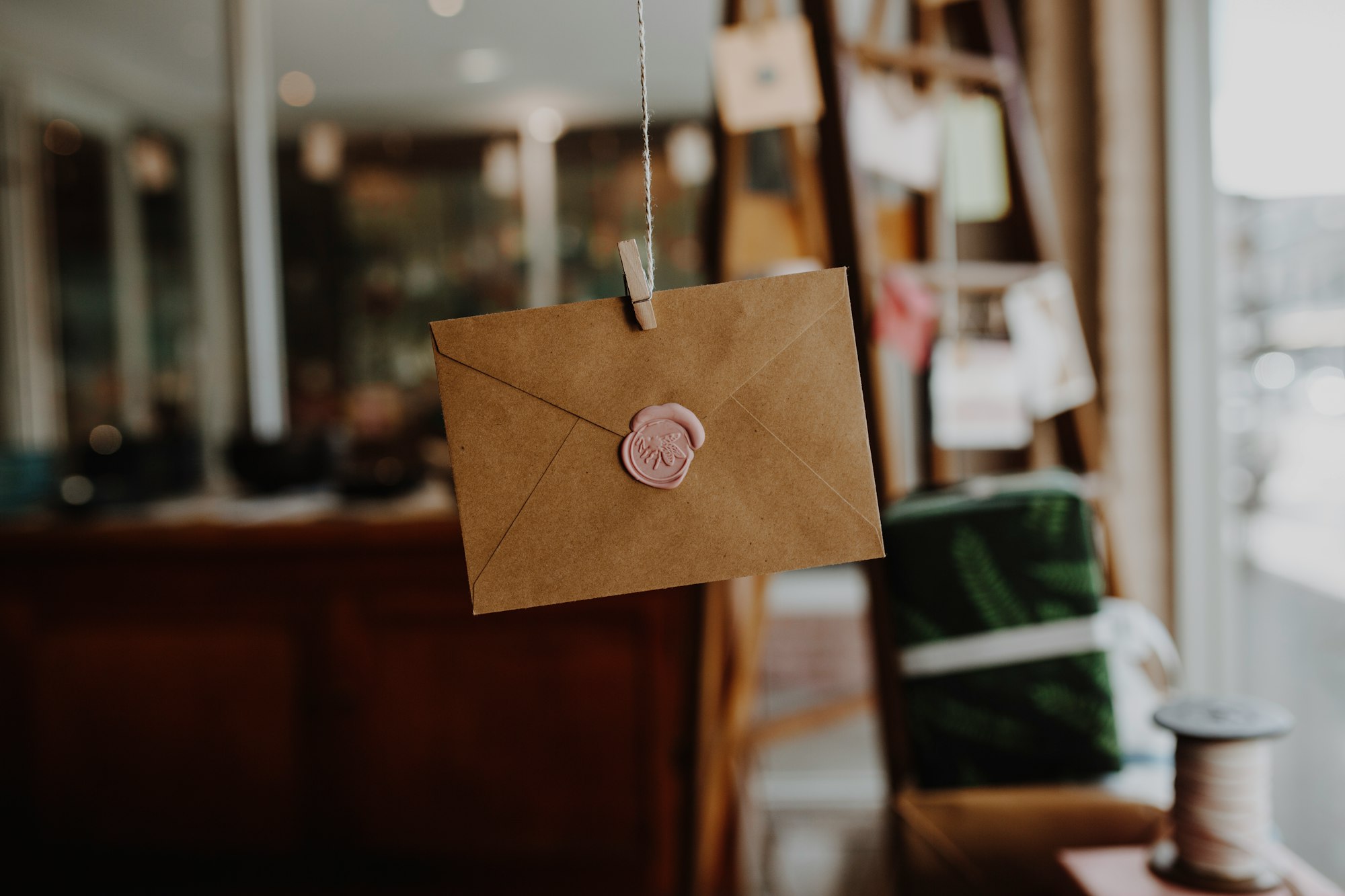 brown paper with silver round pendant