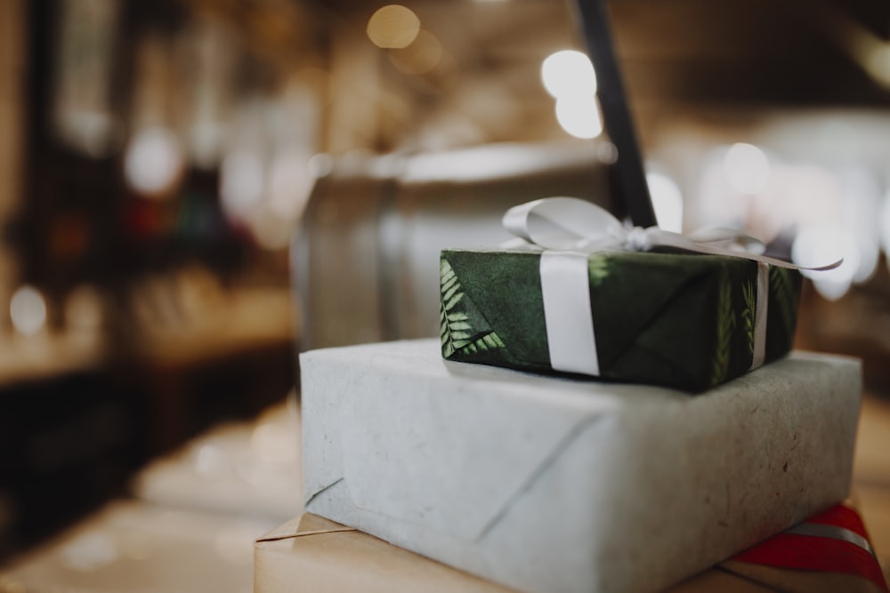 green and white tissue box on white table