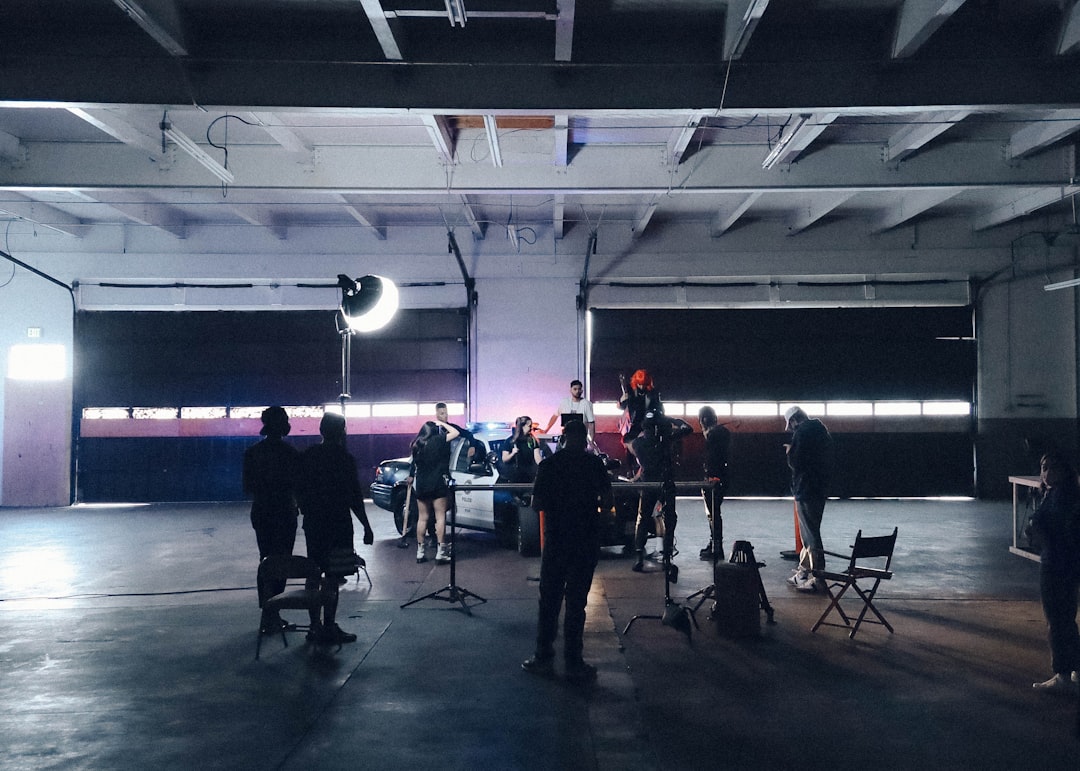 people standing on stage during night time