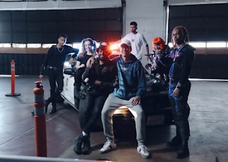 A group of community members working together on outfitting an emergency vehicle in a garage.