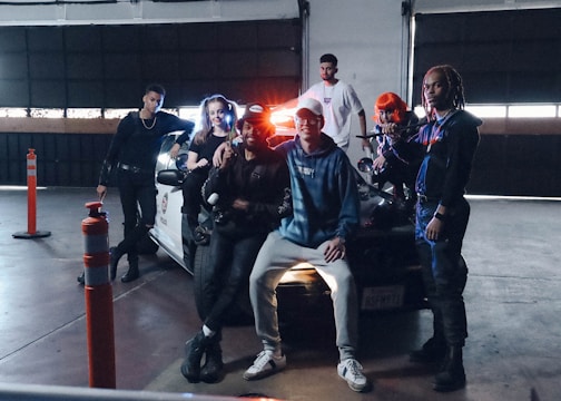 A group of community members working together on outfitting an emergency vehicle in a garage.