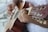 person playing brown acoustic guitar
