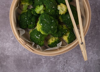green broccoli in white round ceramic bowl
