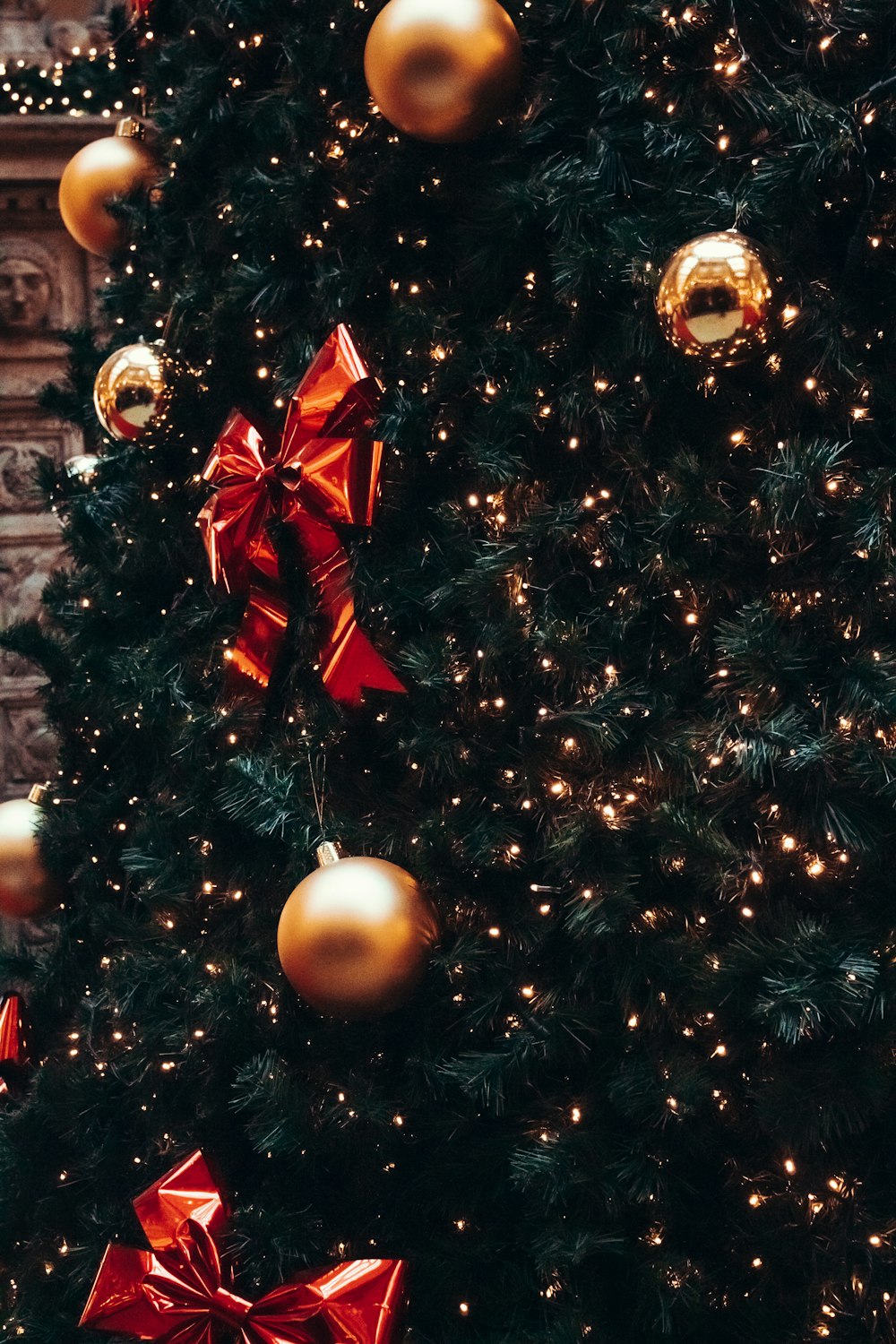 gold and red christmas baubles on christmas tree