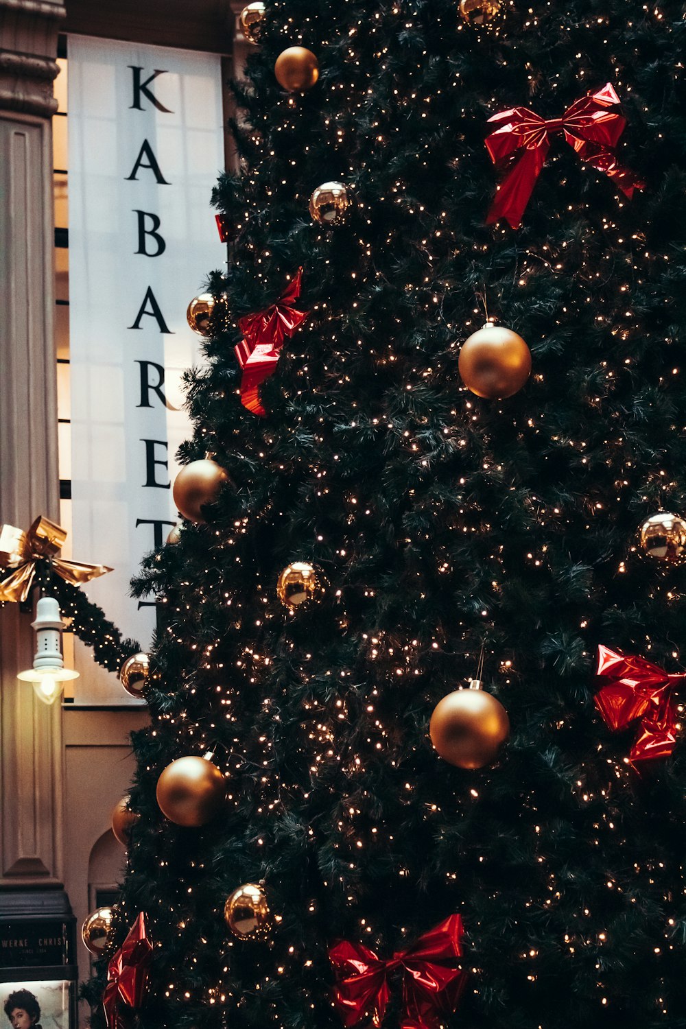 christmas tree with baubles and string lights