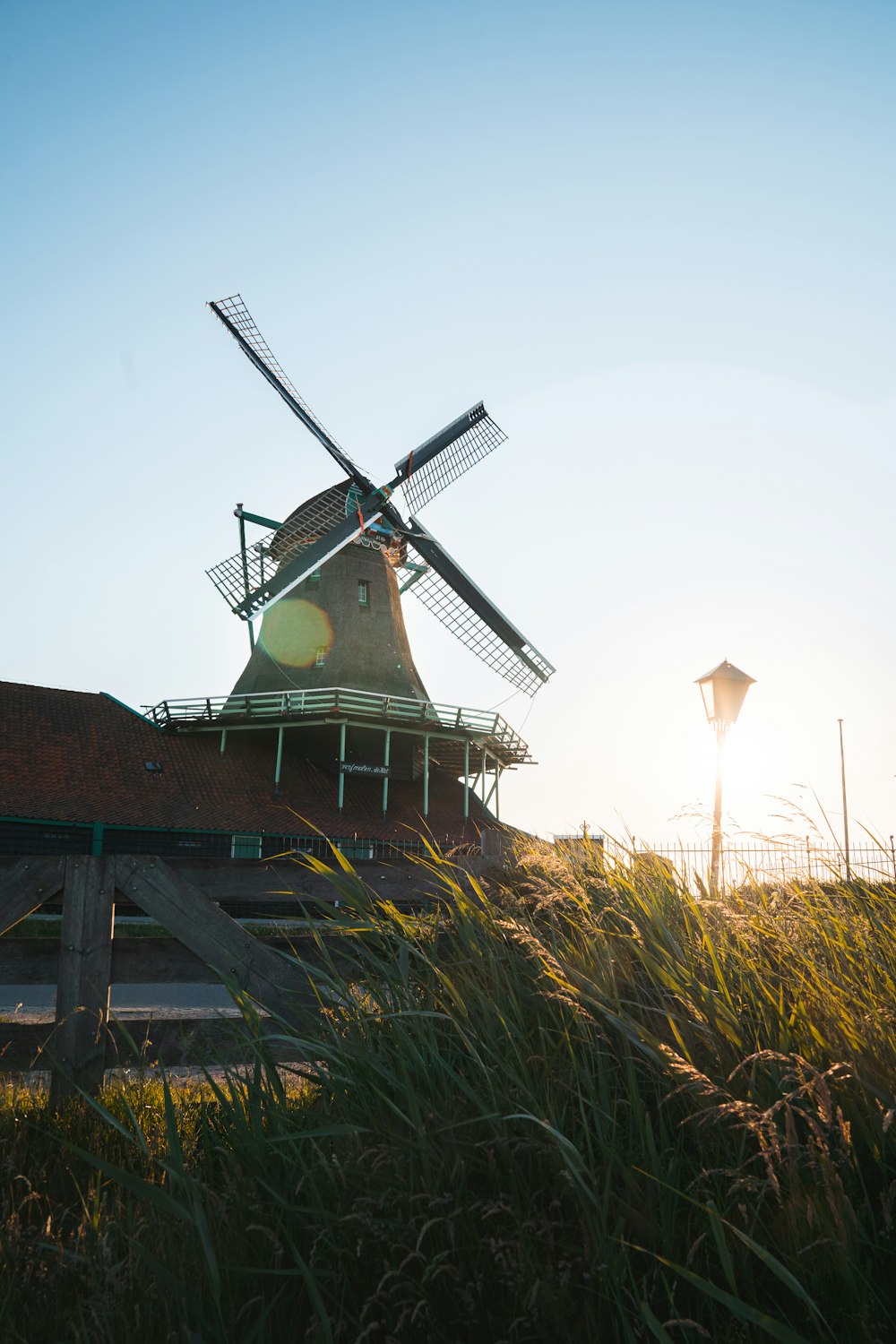 brown windmill on brown grass field during daytime