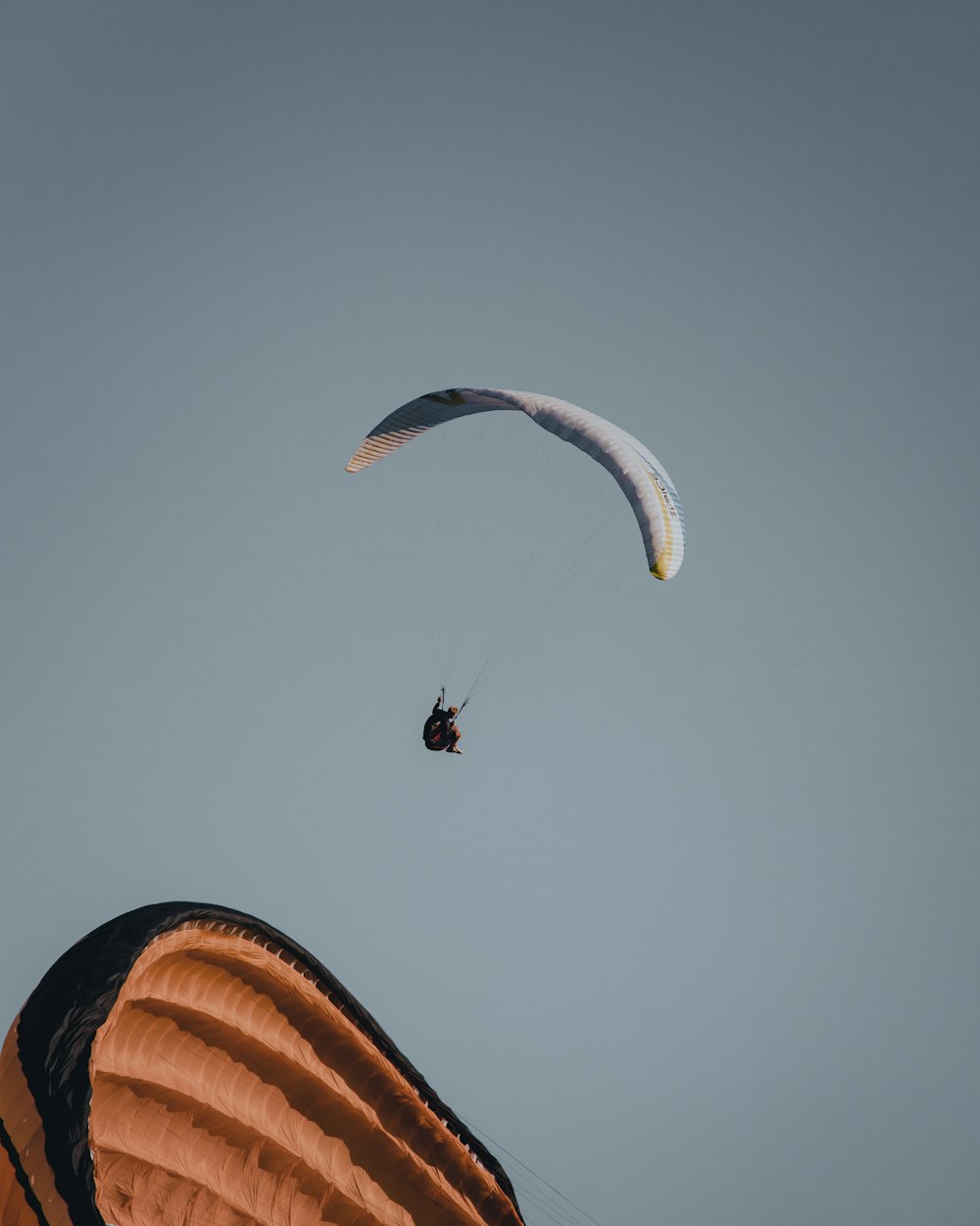 person in parachute during daytime