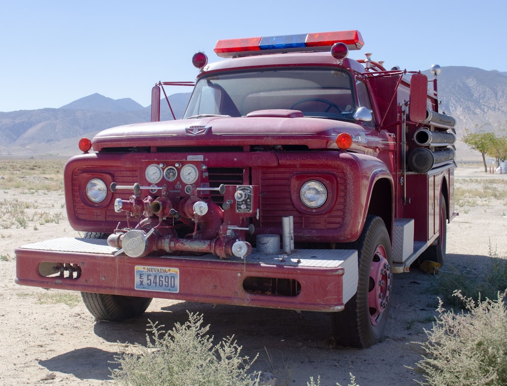 red and white truck on road during daytime