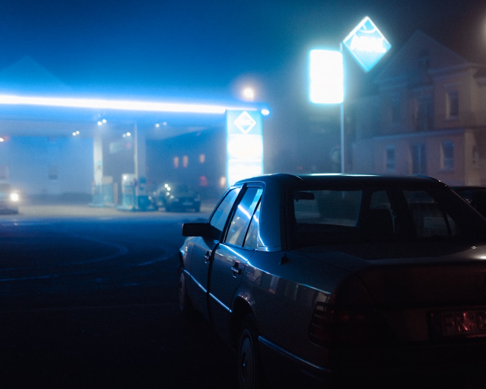 black sedan on road during night time